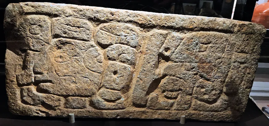 Maya glyph symbols carved into a stone calendar