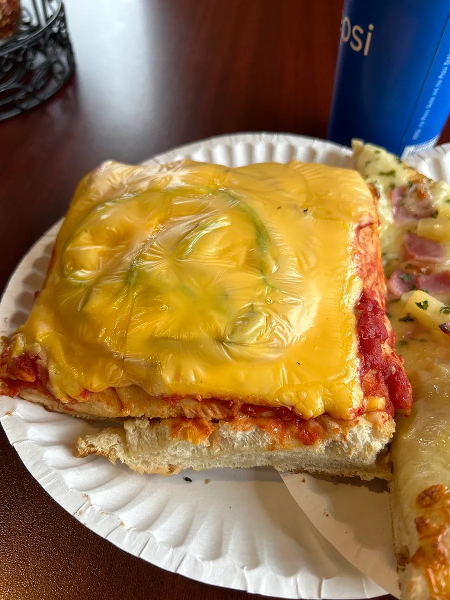 A whole pizza sliced into equal pieces to show parts of a whole