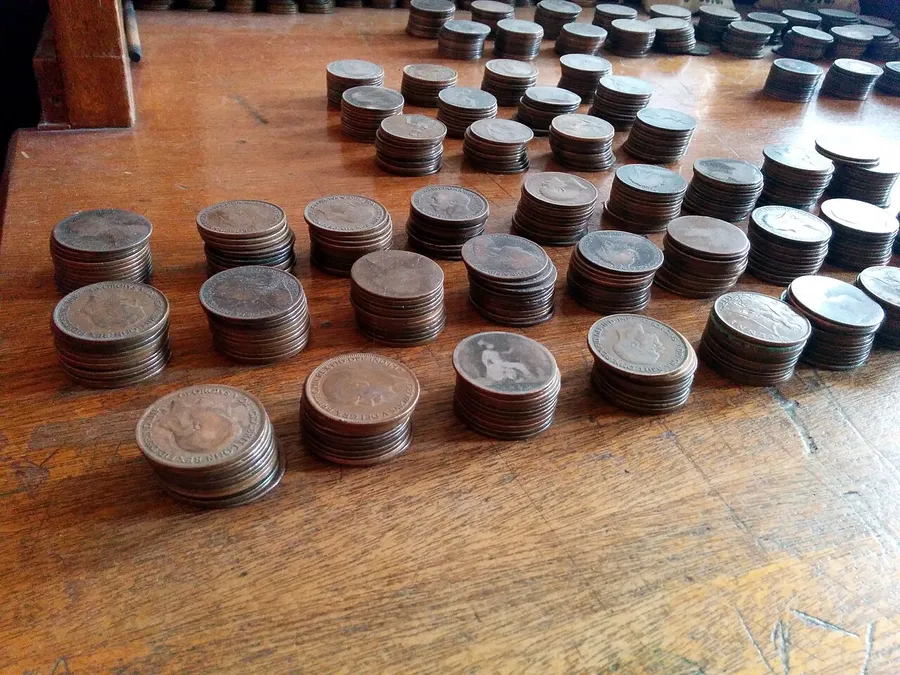 A spread of UK coins from one penny up to a two pound coin