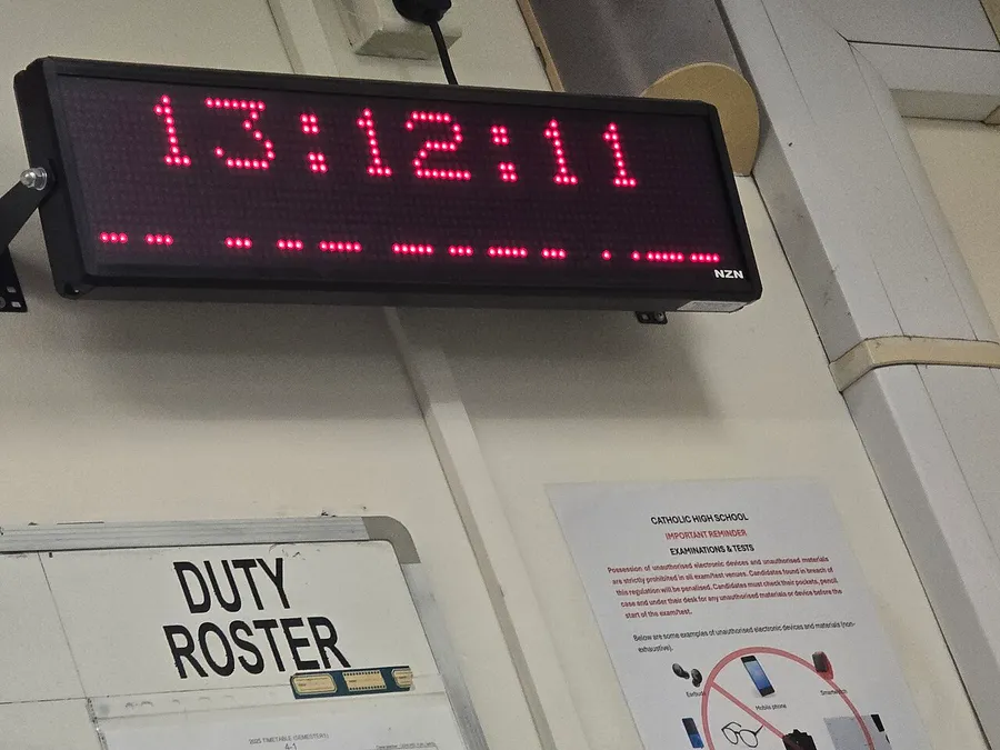 A digital clock showing hours and minutes separated by a colon