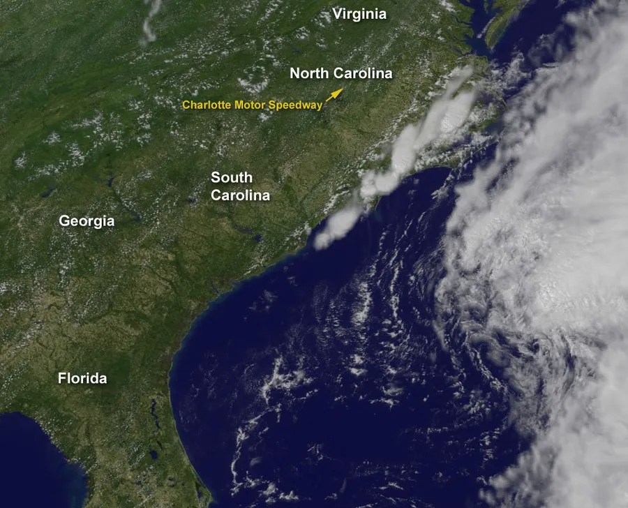 A satellite view of swirling clouds and a storm over Earth