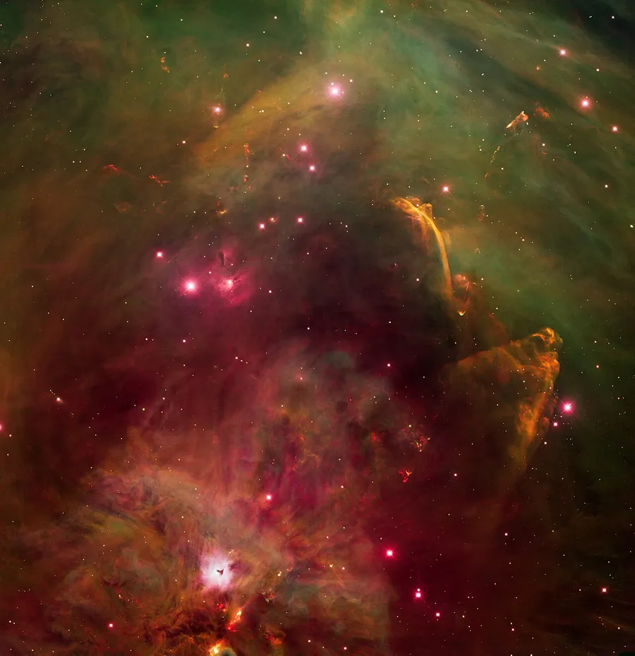 A glowing nebula of gas and dust where new stars are forming